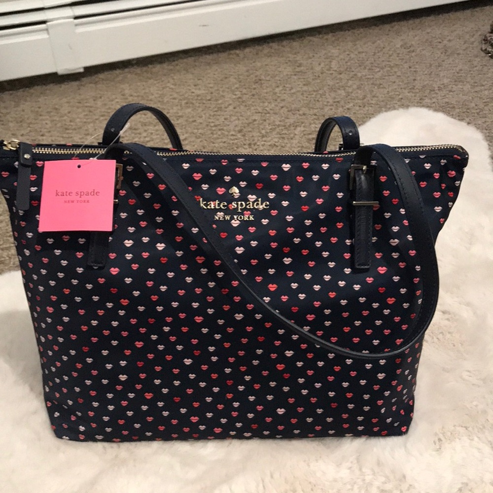 Brand new Kate spade Watson lane navy Kiss bag